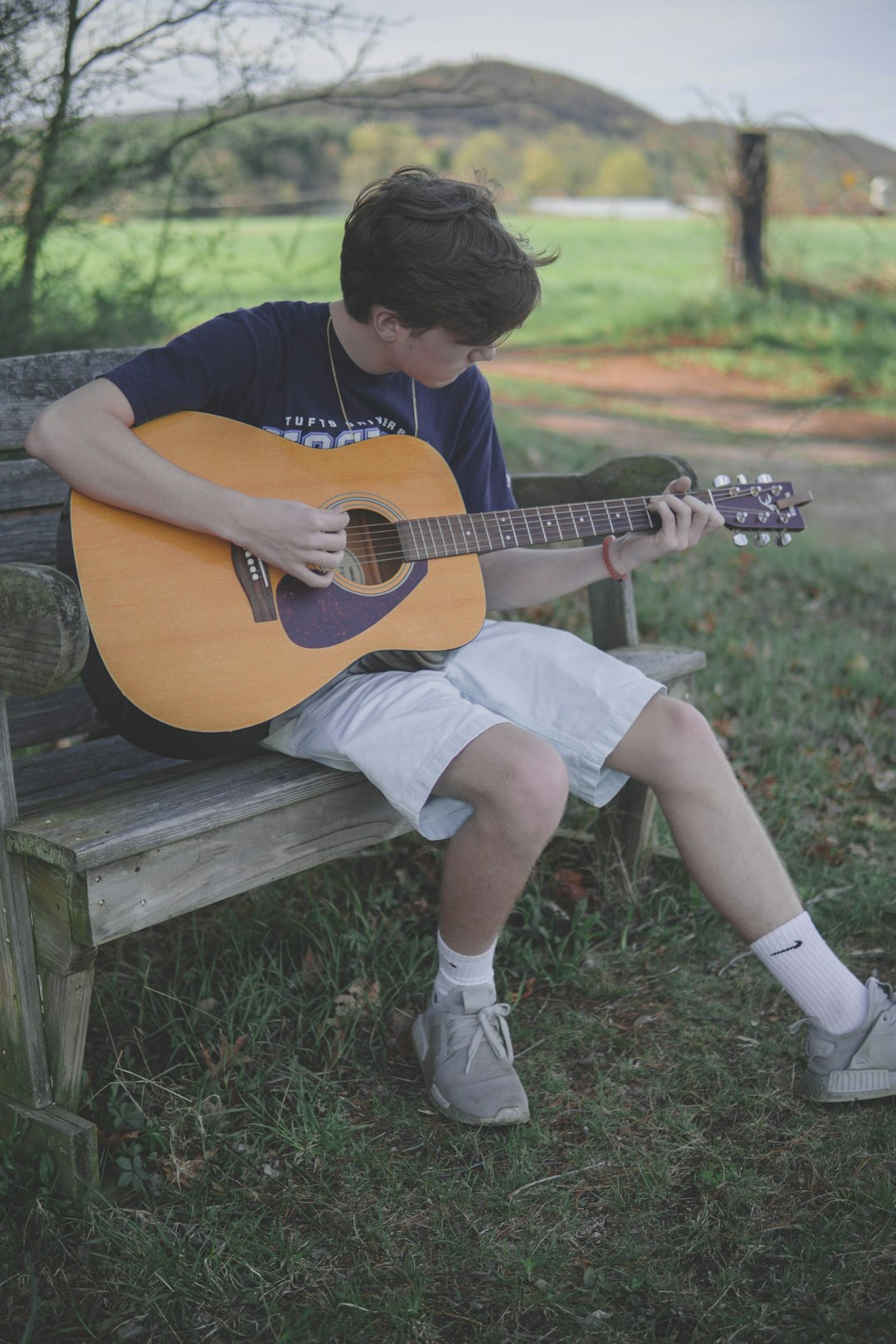 man-playing-brown-acoustic-guitar-gdkjr9dtoqc